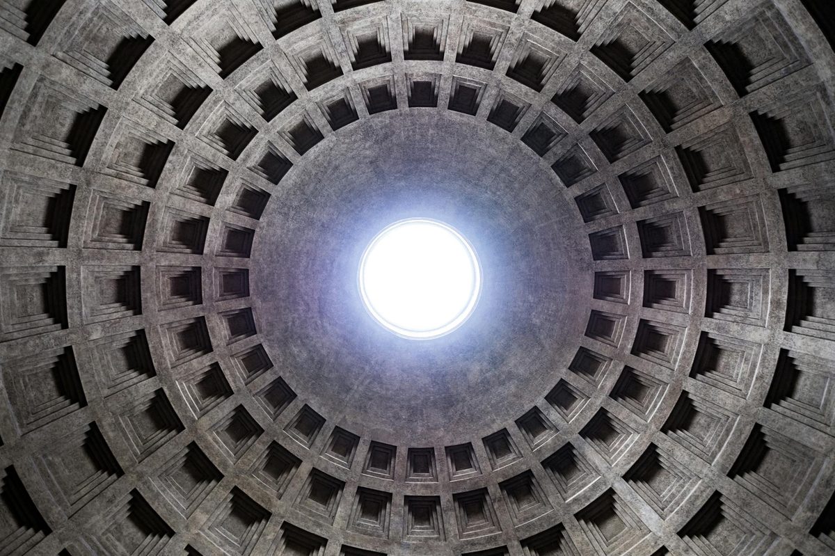 The famous oculus inside the Pantheon dome with light streaming through