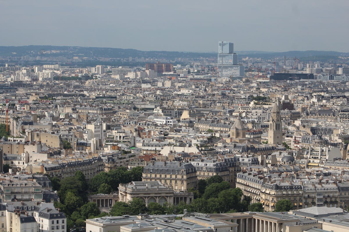 Aerial view of Paris with Montparnasse Tower standing tall above the surrounding rooftops