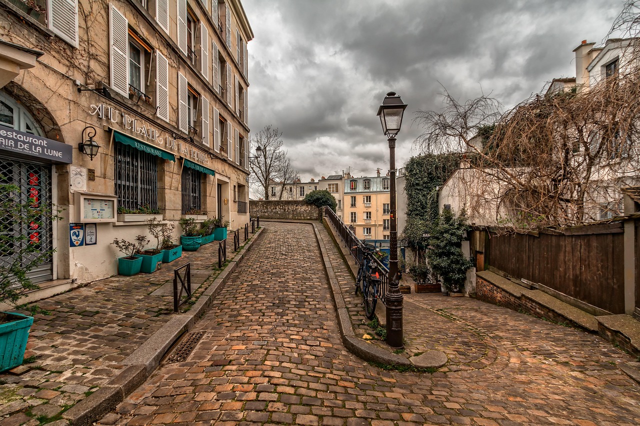 Cobblestone street in Montmartre Paris with old town architecture
