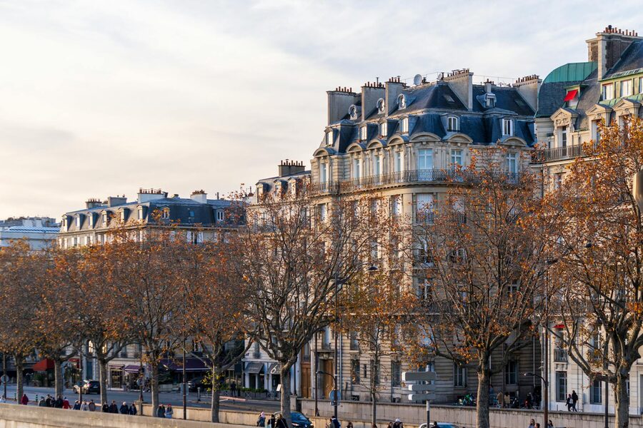 Classic Haussmann architecture in Paris with ornate balconies and limestone facades