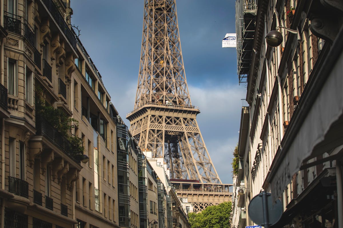 Eiffel Tower viewed through a Paris street lined with Haussmann buildings
