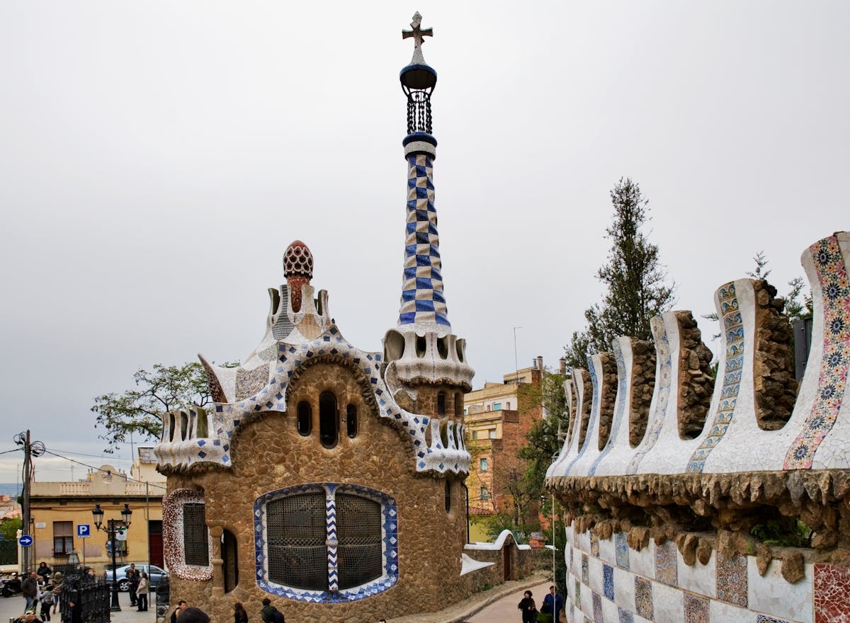 Colorful mosaic architecture and whimsical structures at Park Guell Barcelona
