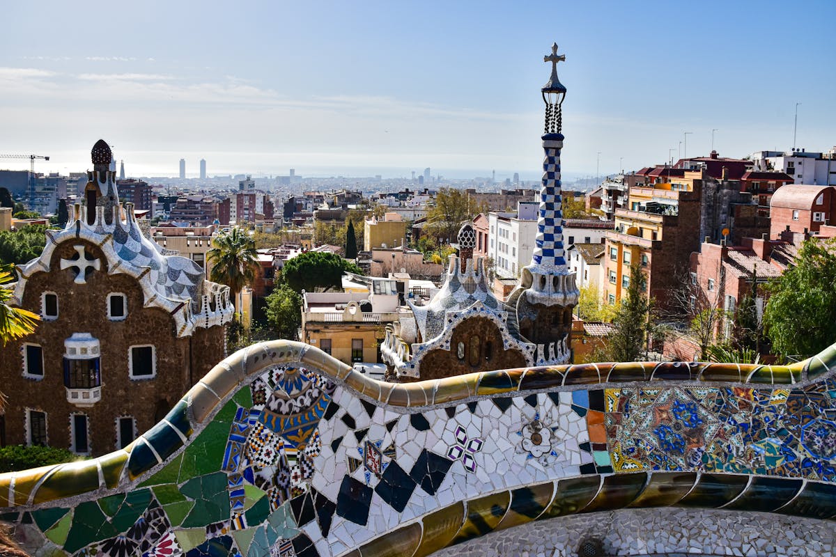 Gaudi mosaic architecture at Park Guell with Barcelona city views