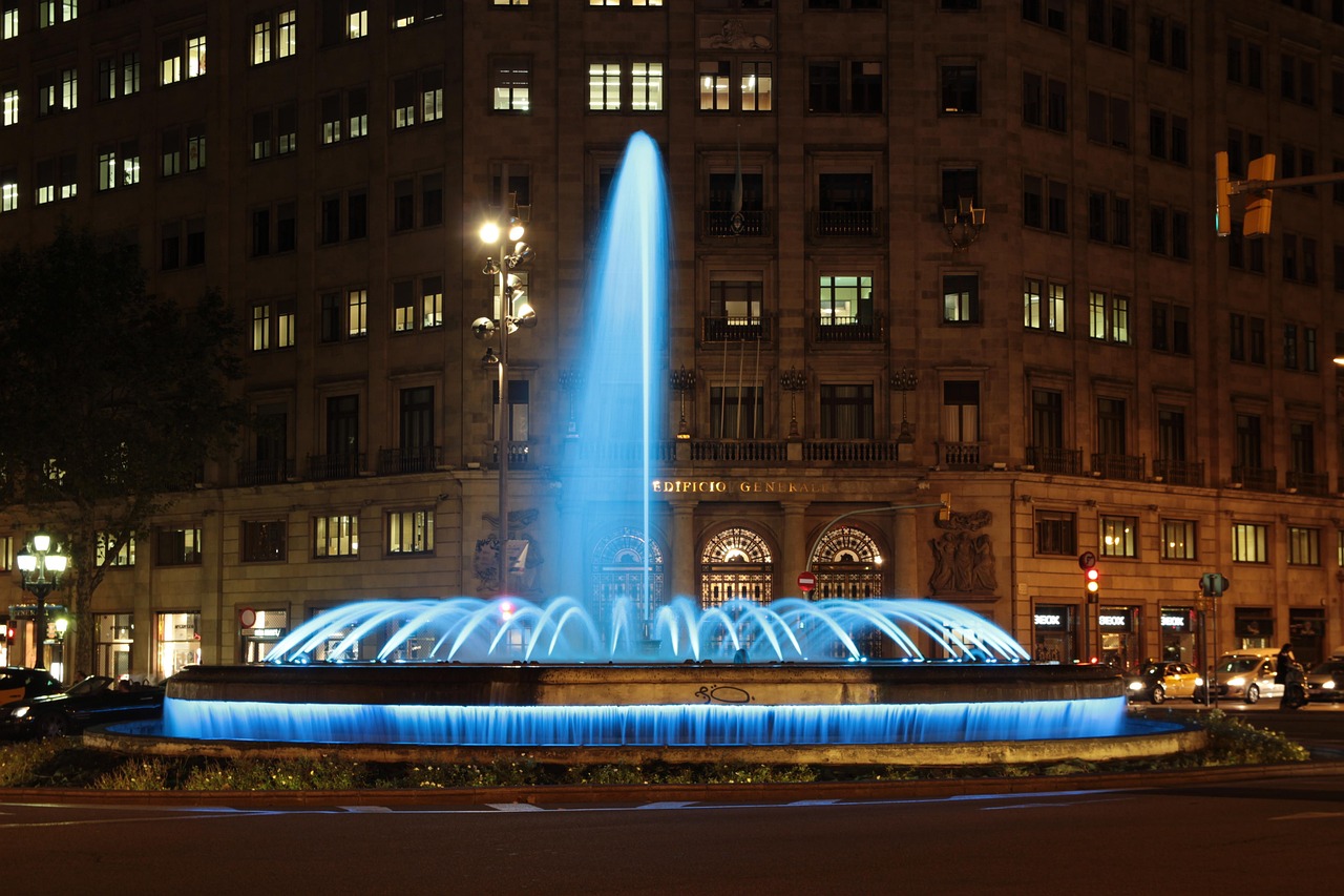 Passeig de Gracia boulevard in Barcelona with its fountains and tree-lined walkway