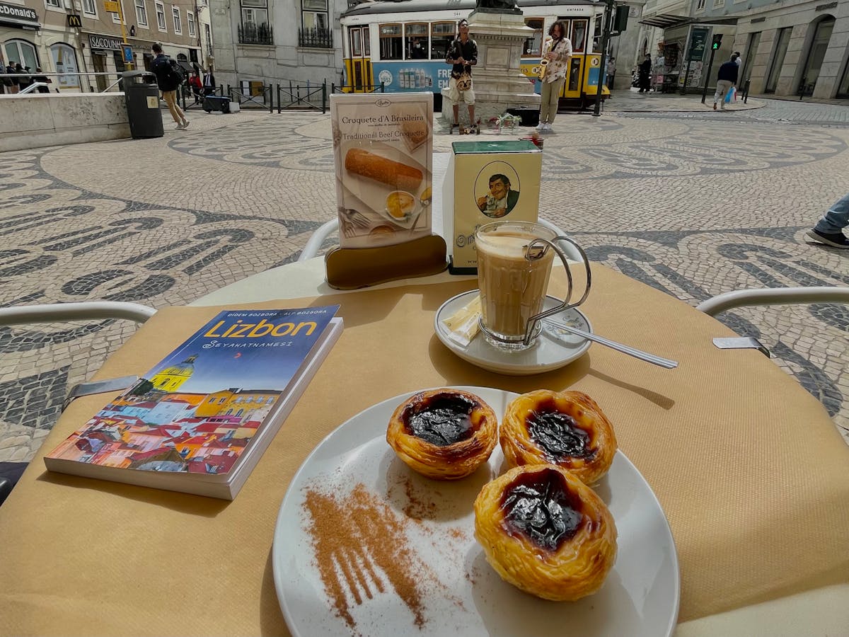 Pasteis de nata custard tarts and coffee at a traditional Lisbon cafe