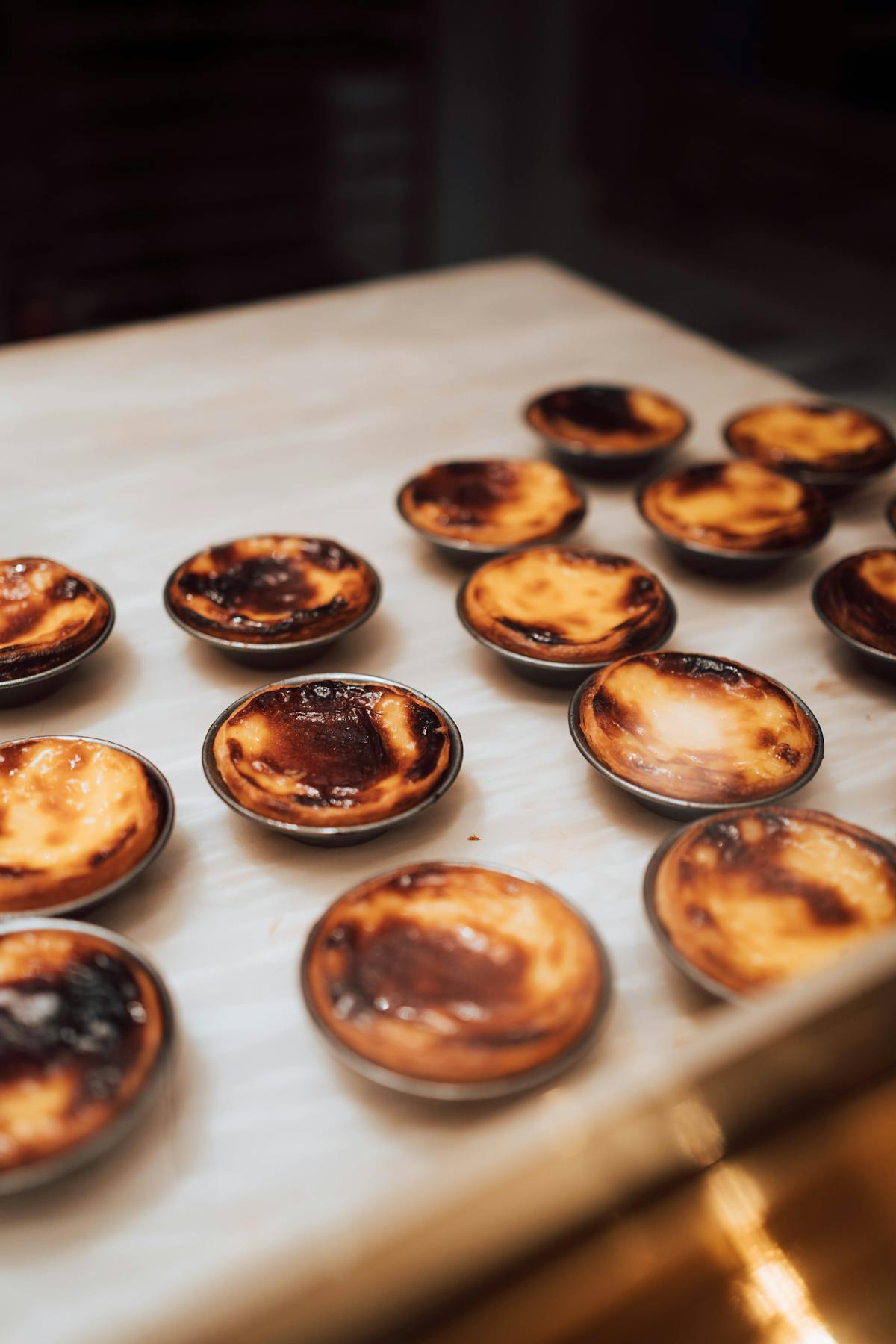 Rows of pastel de nata at a traditional Lisbon bakery