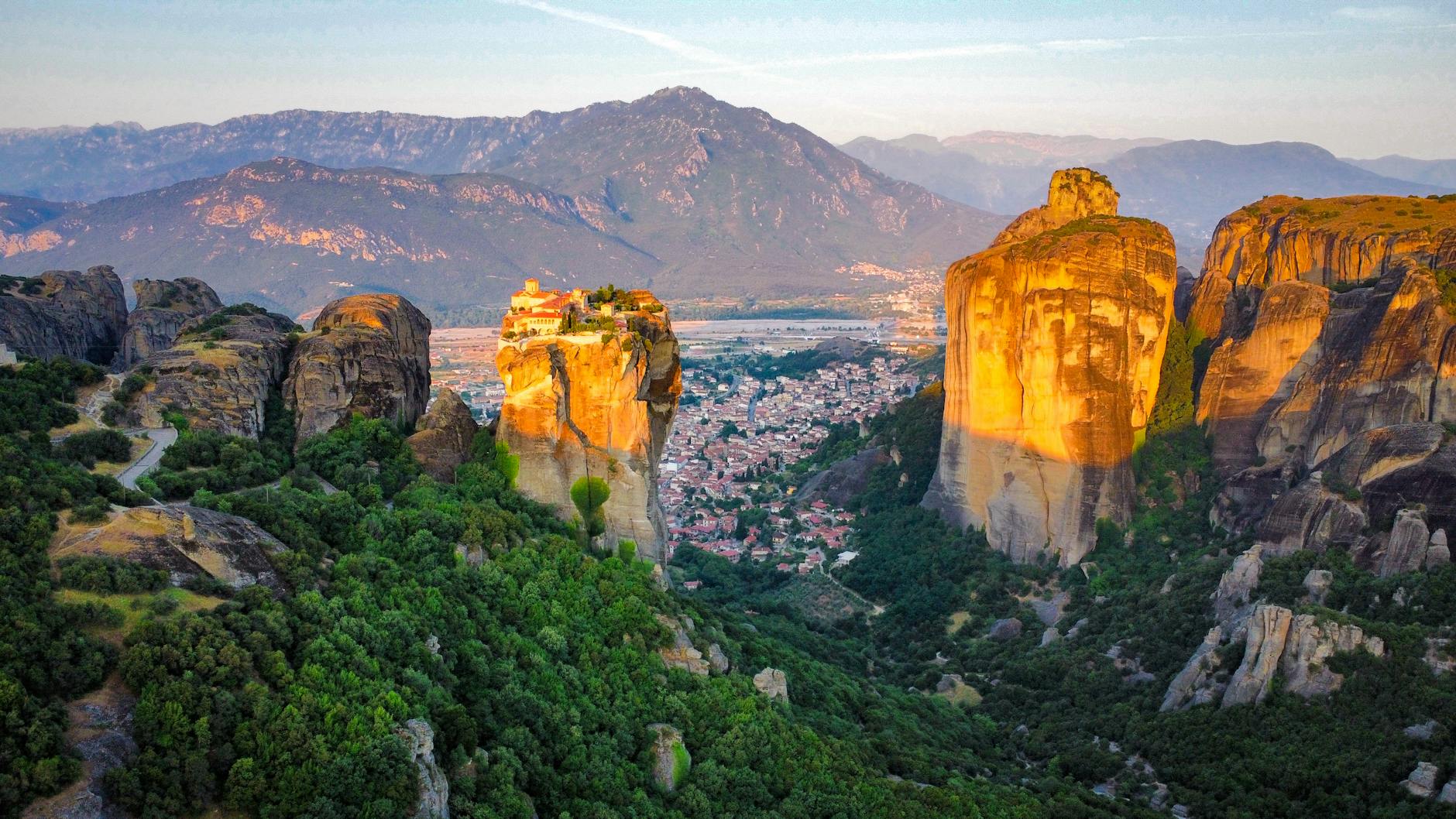 Aerial view of Meteora monasteries perched on massive rock pillars in Kalabaka Greece