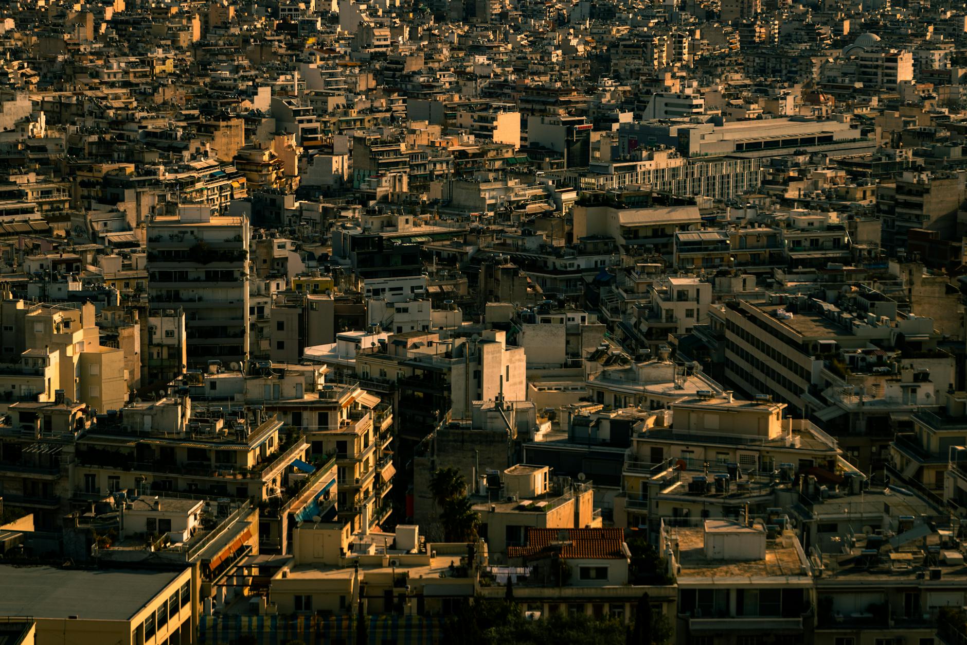 Aerial view of Athens Greece cityscape showing dense urban architecture at twilight