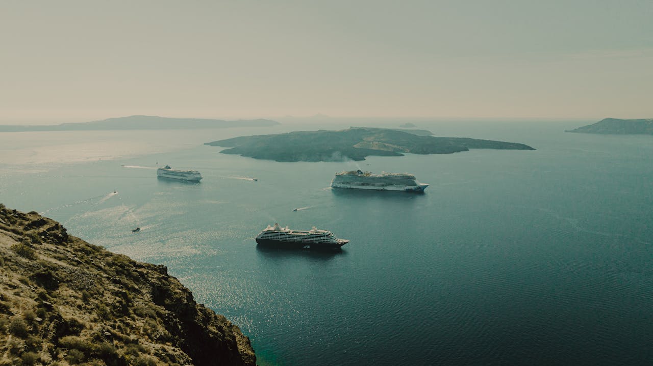 Ships anchored in Santorini caldera waters from above