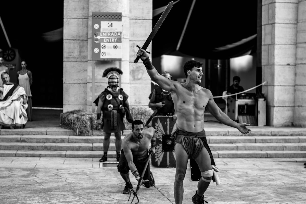 Men reenacting a gladiatorial sword fight with period weapons