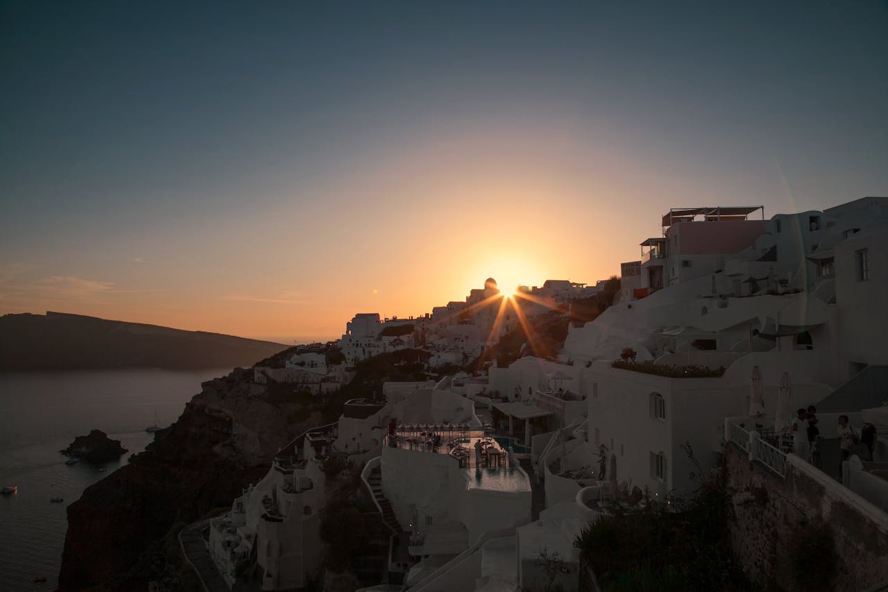 Sunset light over Santorini white buildings and caldera