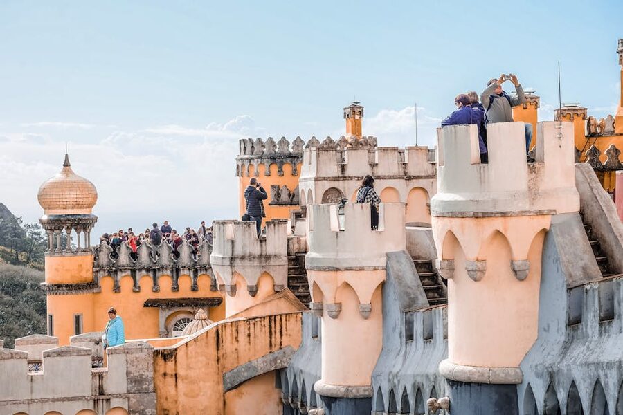 Tourists walking the courtyard at Pena Palace Sintra