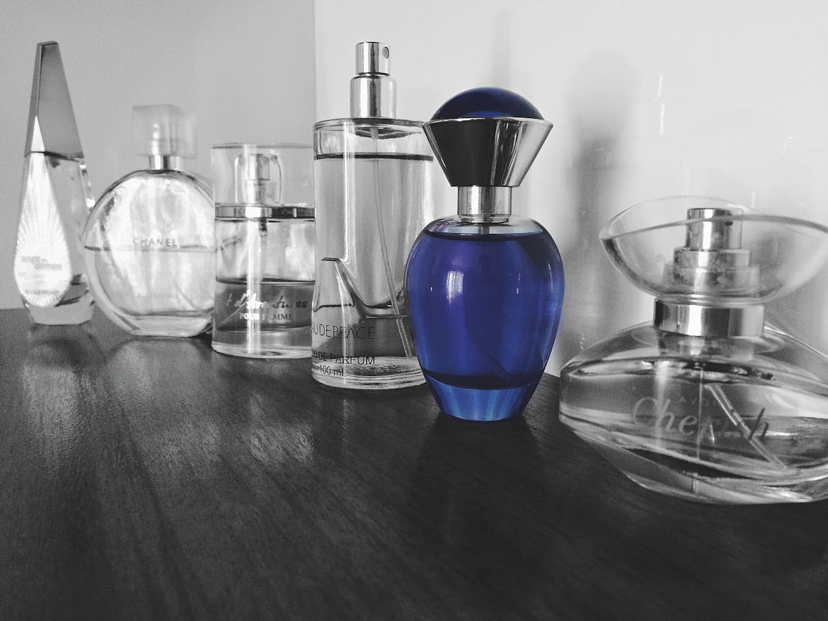 Assorted fragrance bottles in various shapes and colours on display