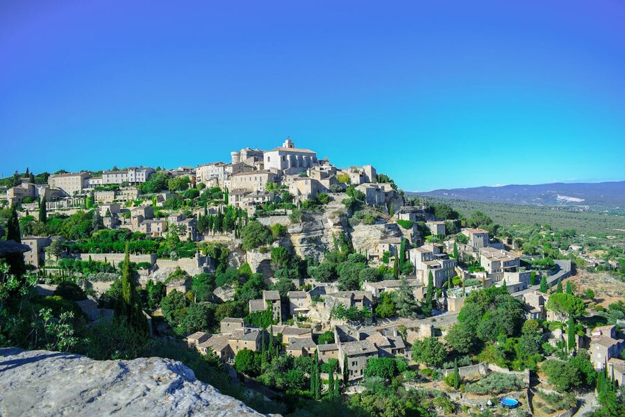 Narrow street in a Provencal hilltop town with stone buildings