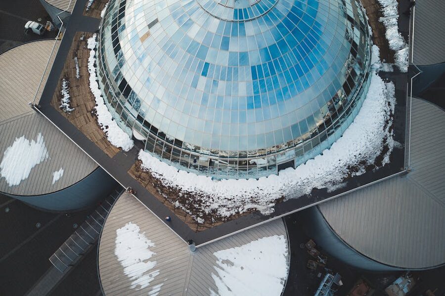 Drone shot of Perlan glass dome Iceland snow-covered