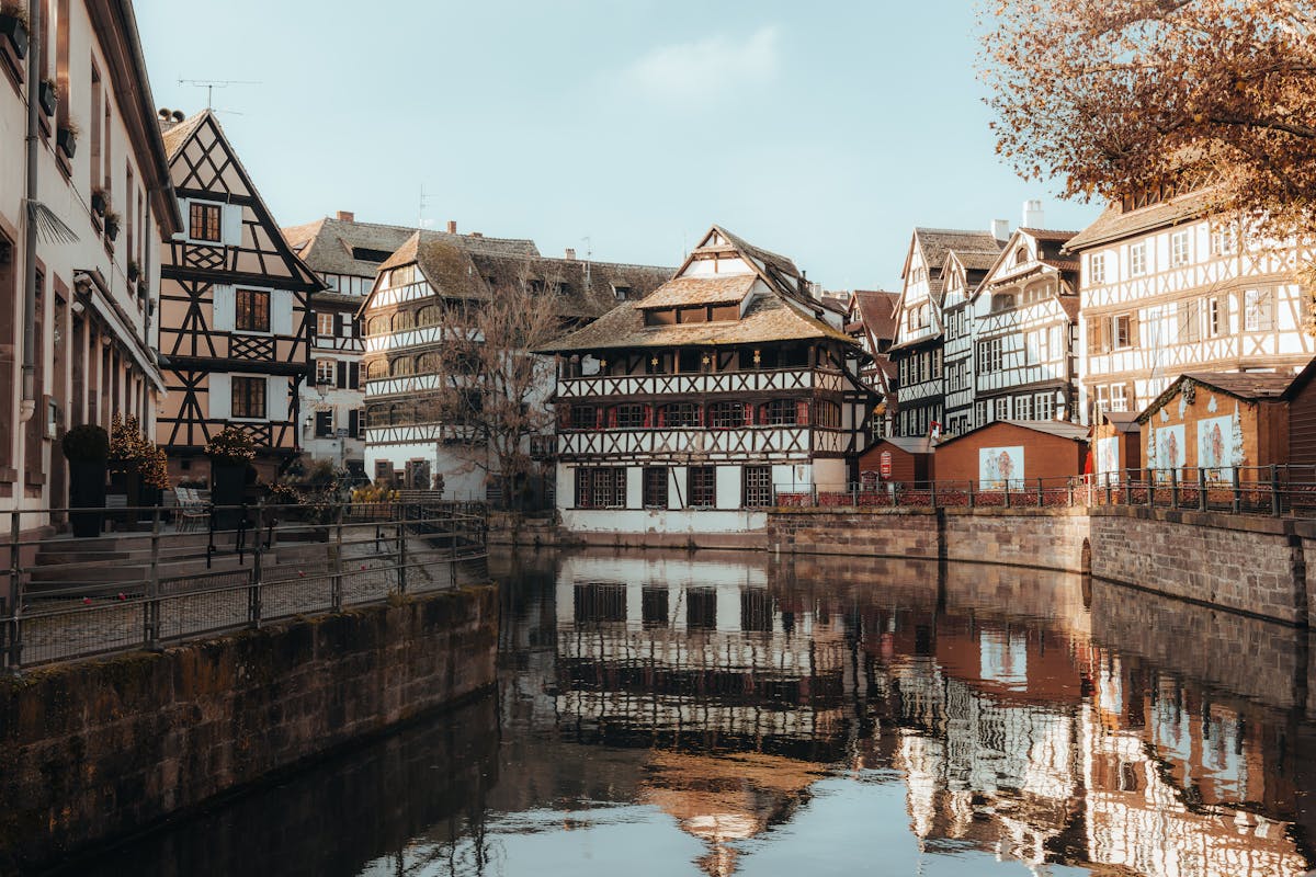 Half-timbered houses in Petite France Strasbourg reflecting on calm water