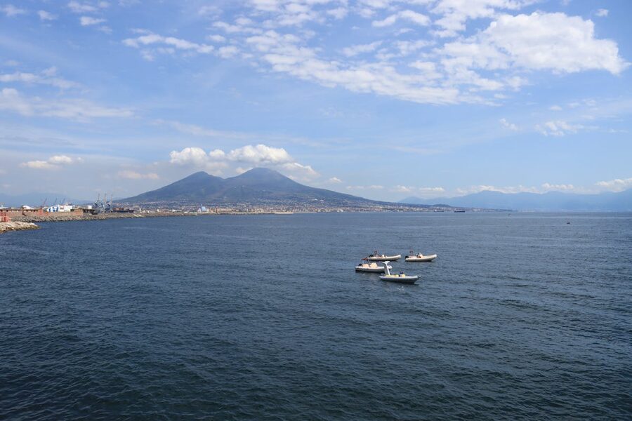 Aerial view of sailing boats on the Bay of Naples with Mount Vesuvius