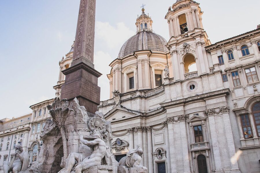 Bernini Fountain of the Four Rivers in Piazza Navona with church facade behind