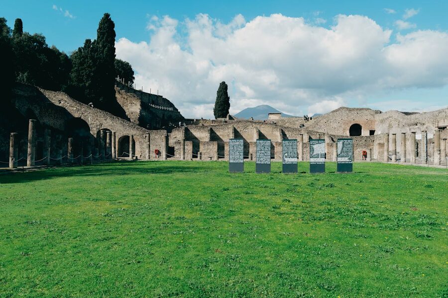Ancient ruins of Pompeii with Mount Vesuvius visible in the distance