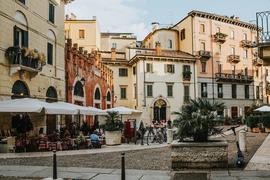 Historic Verona square with sidewalk cafes and old architecture