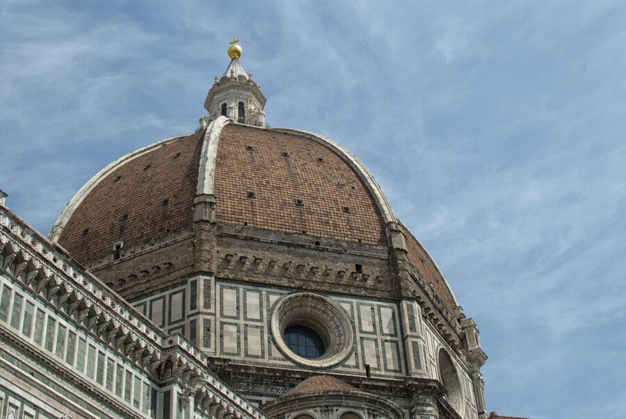 Brunelleschi's Dome seen from the streets of Florence with the dome's massive terracotta structure filling the sky