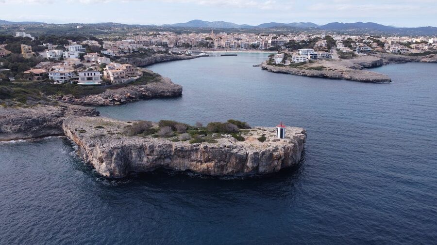 Aerial photograph showing Porto Cristo town, cliffs and Mediterranean sea in Mallorca