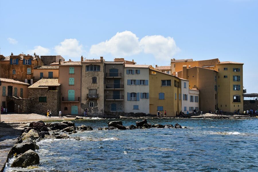 Waterfront buildings in Saint-Tropez painted in warm Mediterranean colours