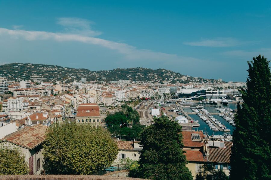 Aerial view of Cannes harbour showing yachts and the coastal cityscape
