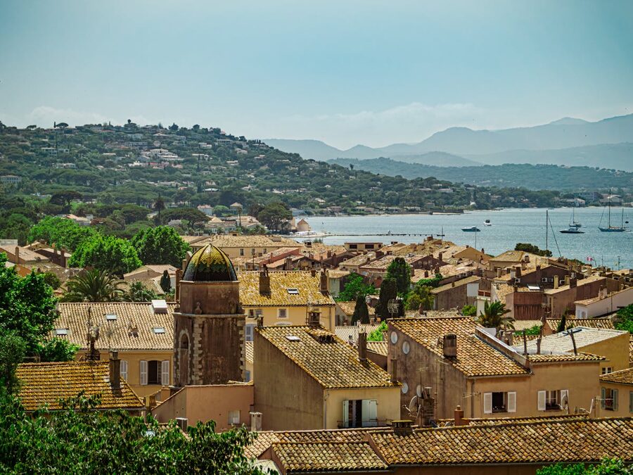 Aerial view of Saint-Tropez rooftops and coastline from above the old town