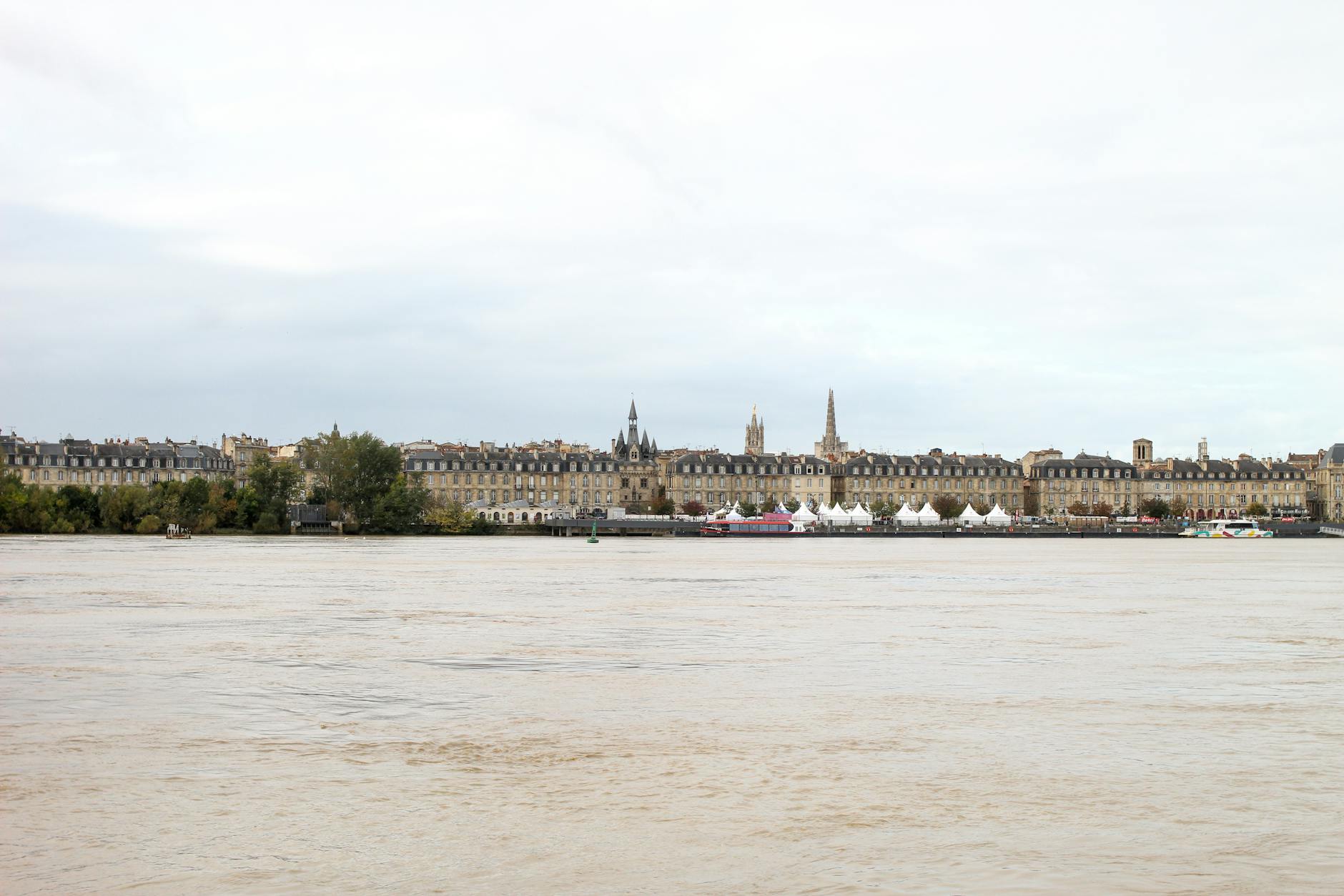 A scenic view of Bordeaux France with historical architecture along the Garonne riverbank