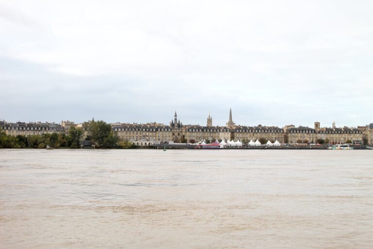 Historic buildings lining the Garonne River waterfront in Bordeaux France
