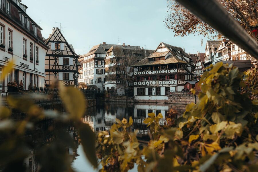 Charming Alsatian half-timbered houses along a narrow canal in the Petite France quarter of Strasbourg