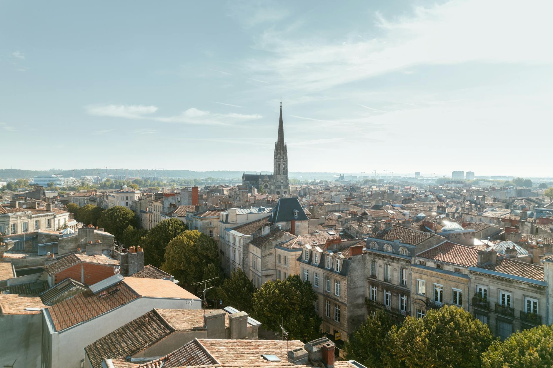 Aerial view of Bordeaux France showing rooftops and iconic church spire