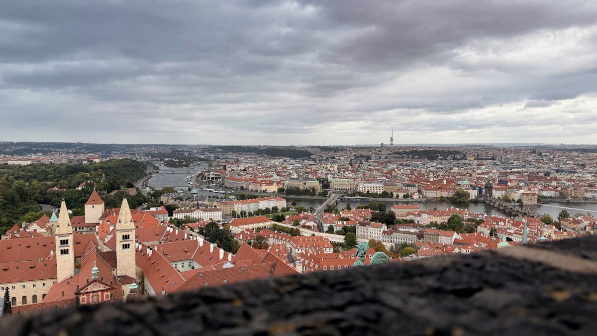 Aerial photograph of Prague showing Prague Castle, the Vltava River, and bridges