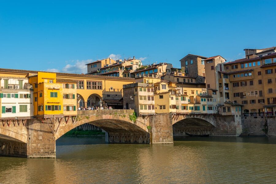View of Ponte Vecchio bridge over the Arno River in Florence on a sunny day