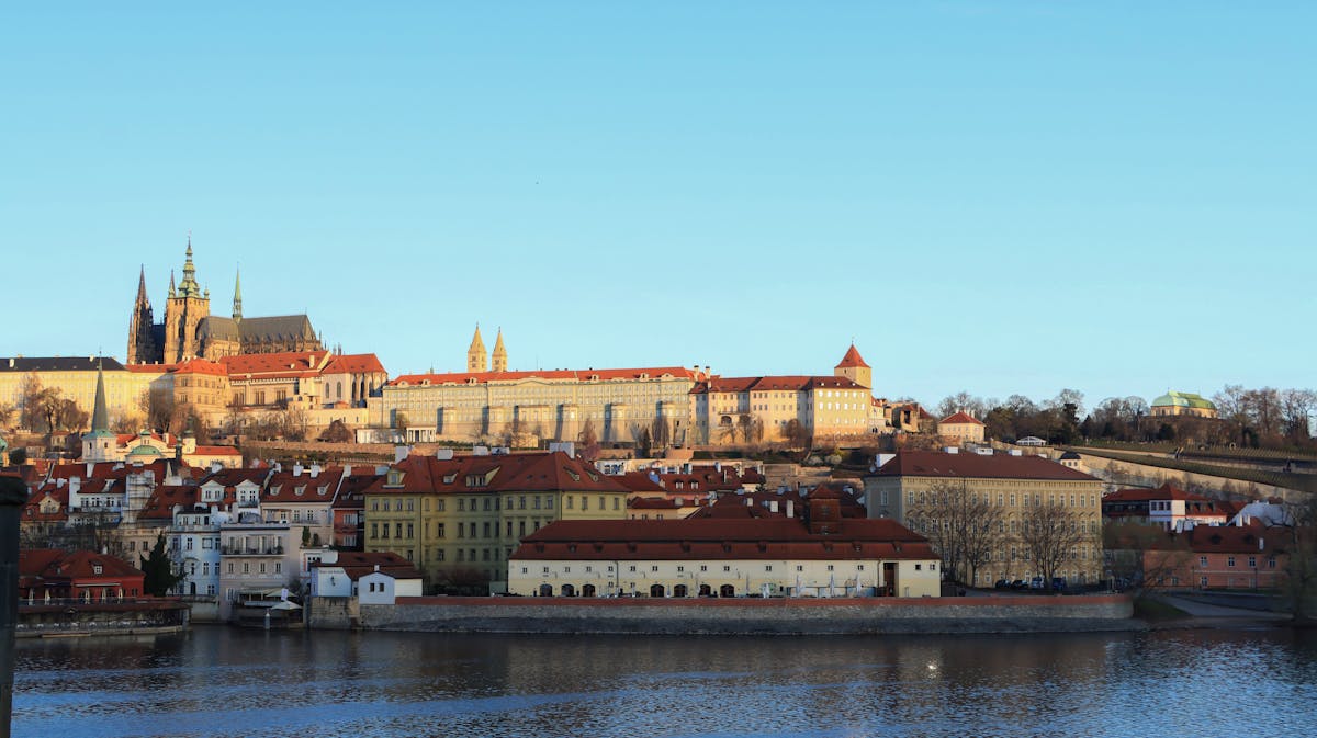 Prague Castle and the Vltava River on a bright summer day with blue sky