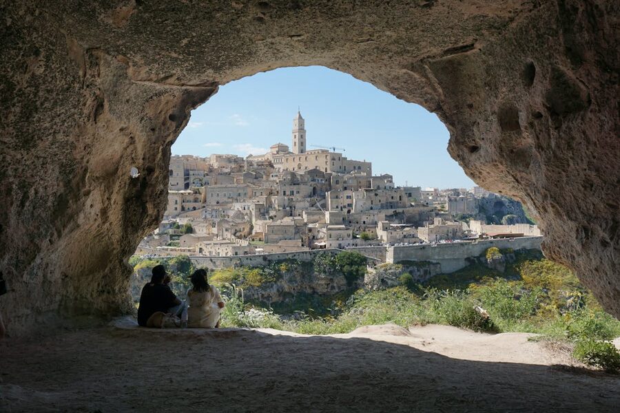 Matera ancient cave dwellings viewed through a natural stone archway