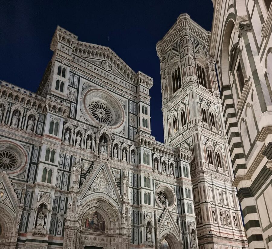 Florence Cathedral illuminated at night showcasing Gothic architecture