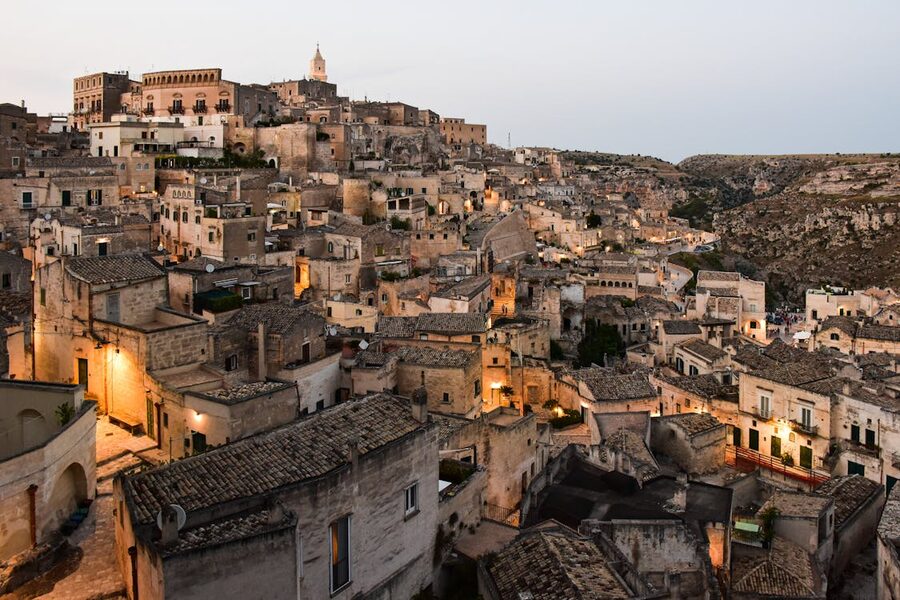 Panoramic view of Matera ancient city illuminated at dusk