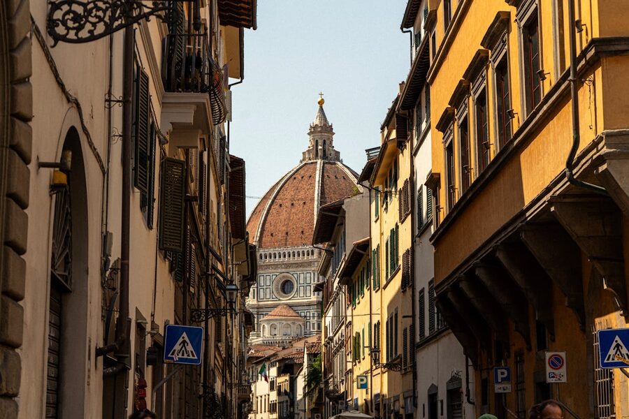 Florence street with the Duomo cathedral visible in the background