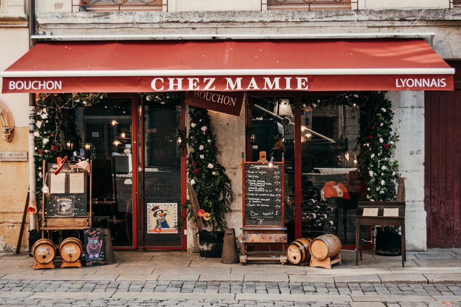 Cosy French bistro in Lyon decorated with festive lights and classic French charm
