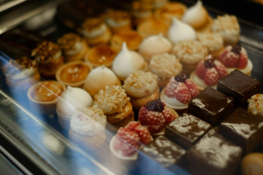 Assortment of French pastries, tarts and chocolates displayed in a bakery