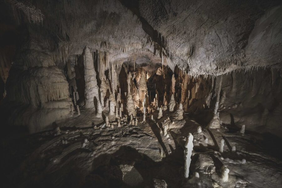 Impressive stalactites and stalagmites formations inside an underground cave