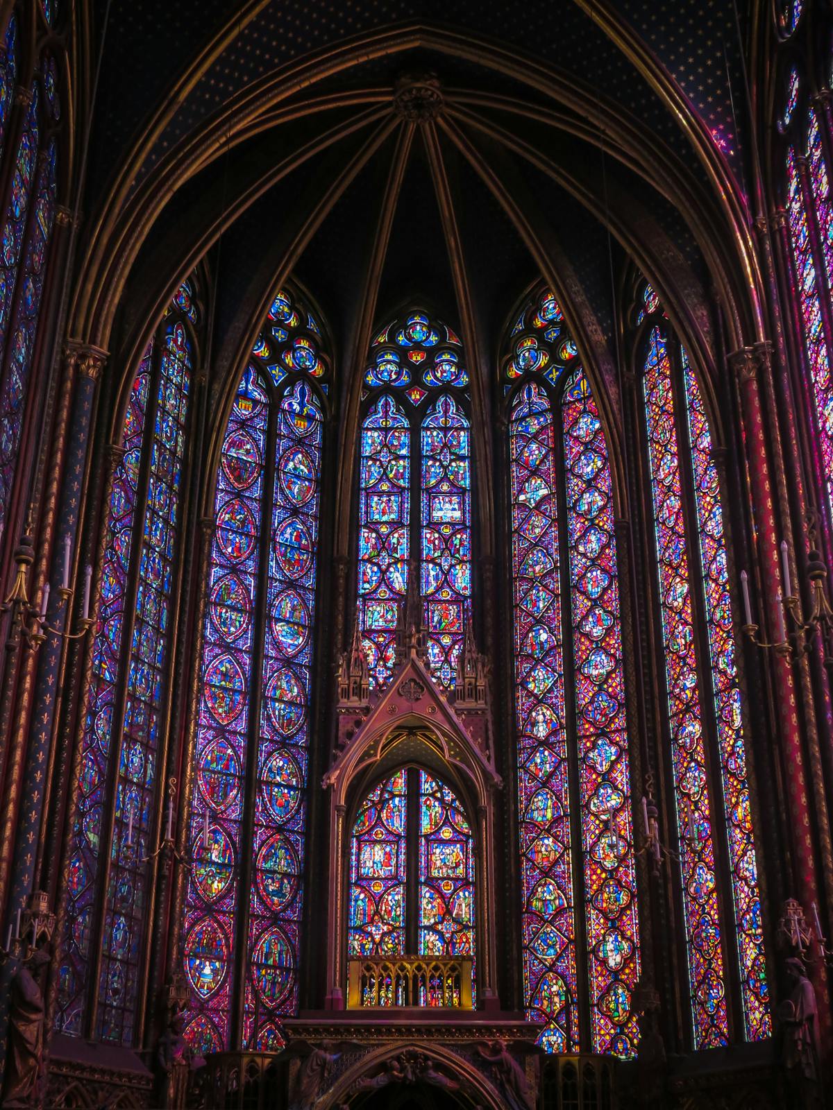 Vibrant blues and reds of Sainte-Chapelle's stained glass windows up close