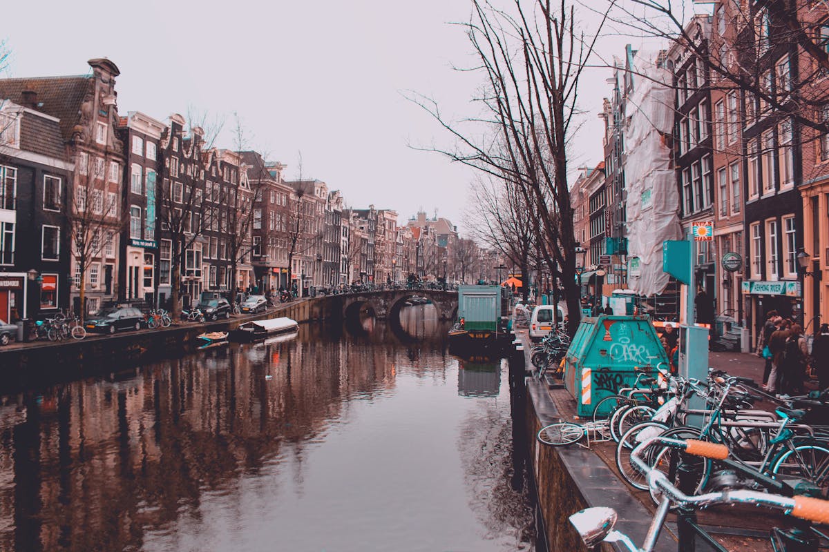Amsterdam canal lined with traditional Dutch houses