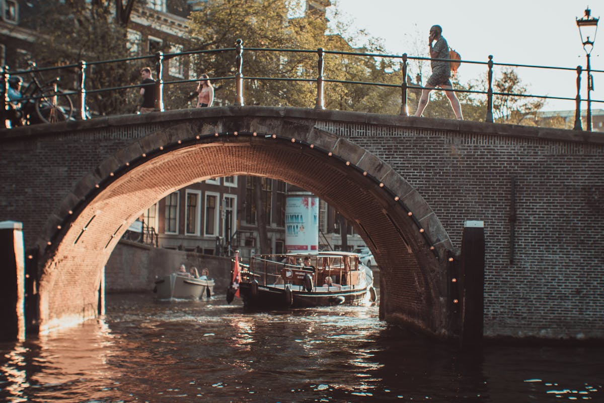 View under a bridge over an Amsterdam canal