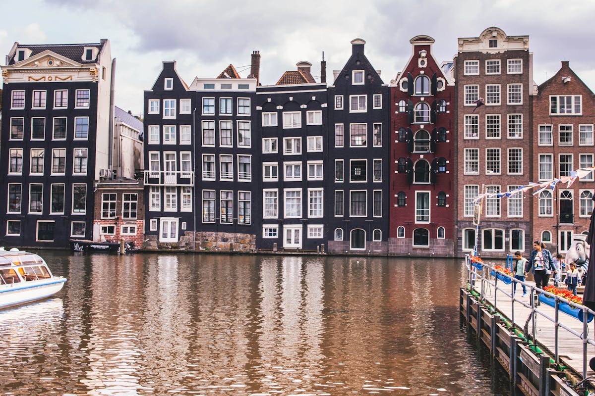 Historic Amsterdam canal houses with reflections in the water