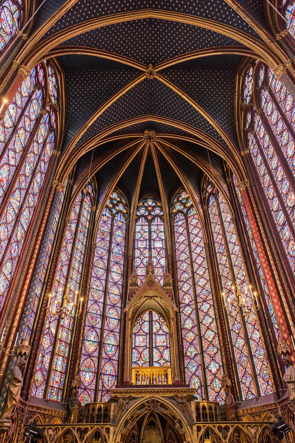 Sainte-Chapelle's Gothic architecture bathed in colored light from the stained glass