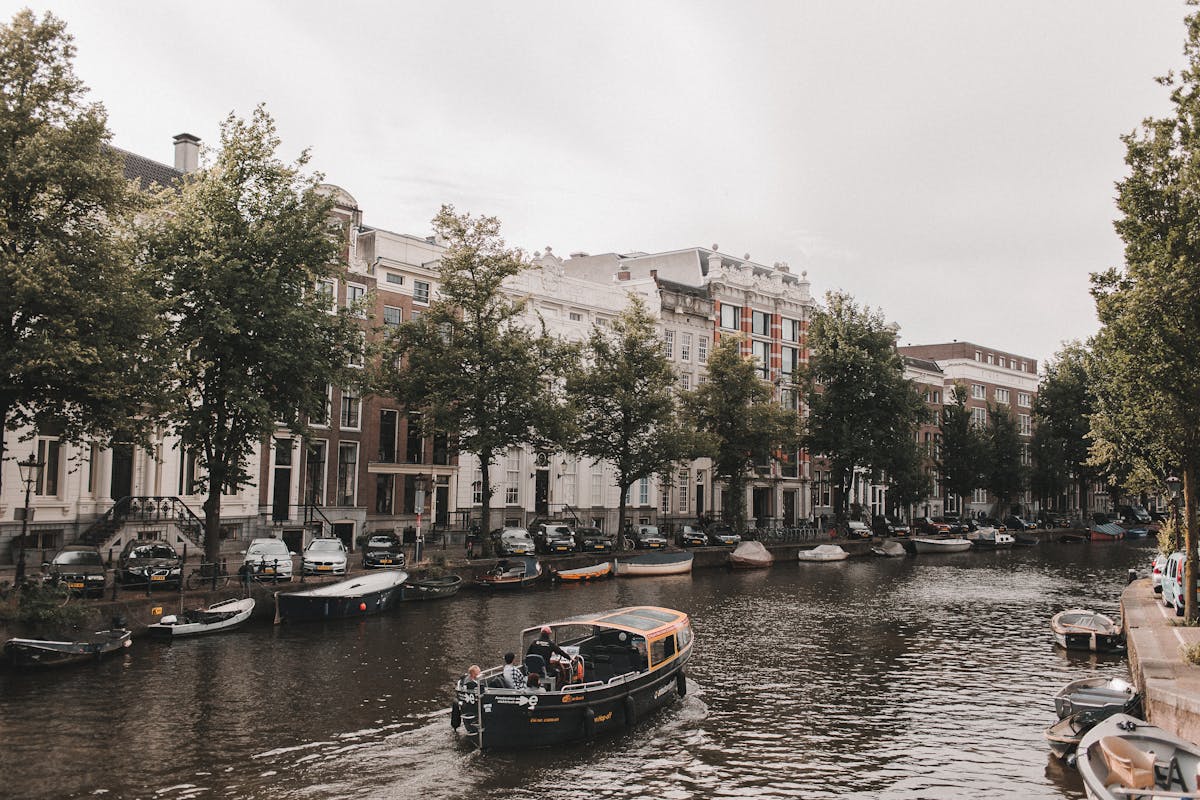 Amsterdam canal with row of historic buildings