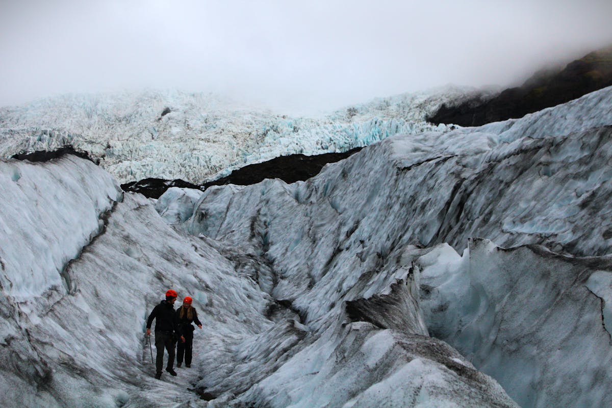 Hikers trekking on an Icelandic glacier with crampons